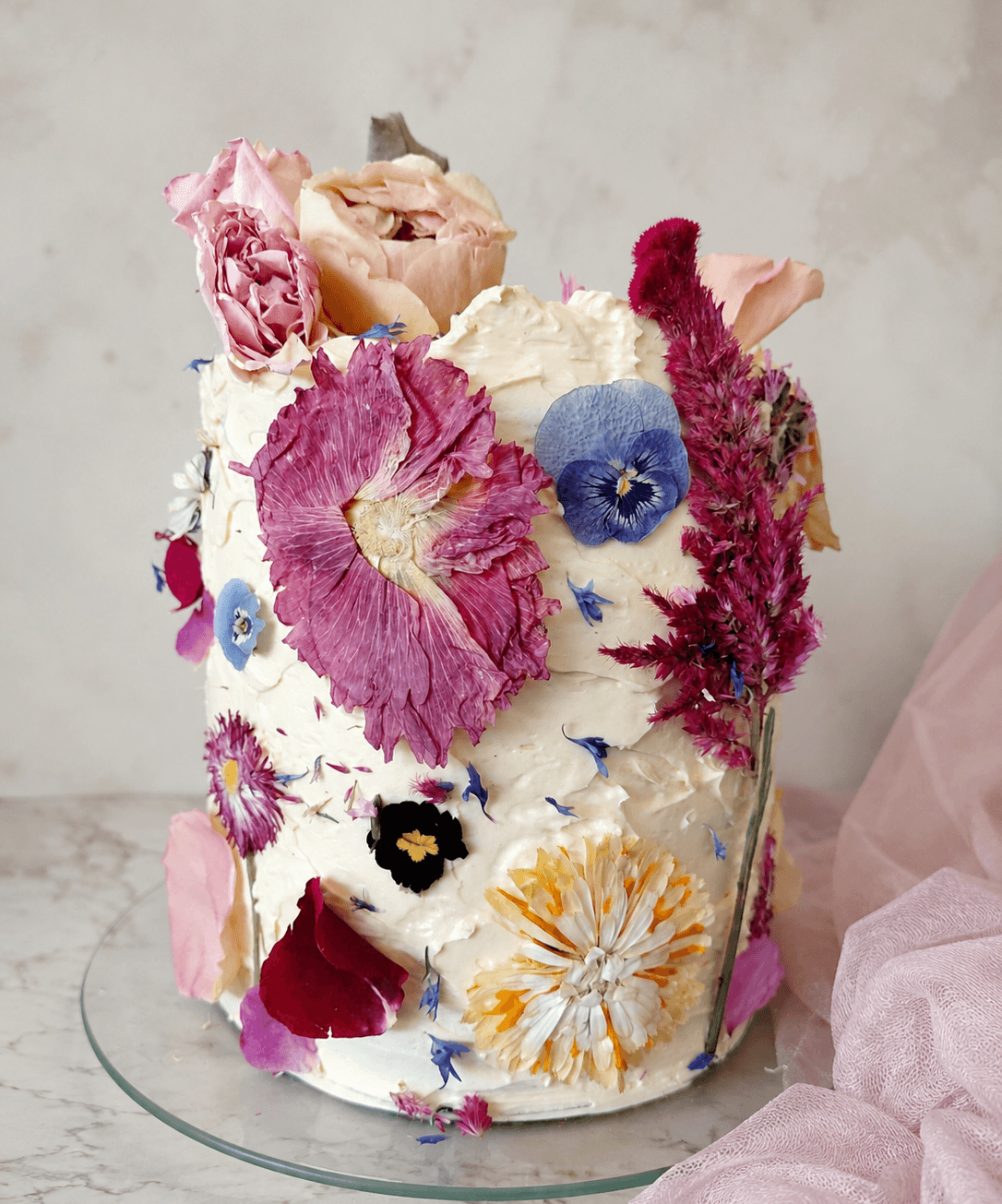 Handcrafted Luxury Signature Cake with smooth buttercream and dried edible roses