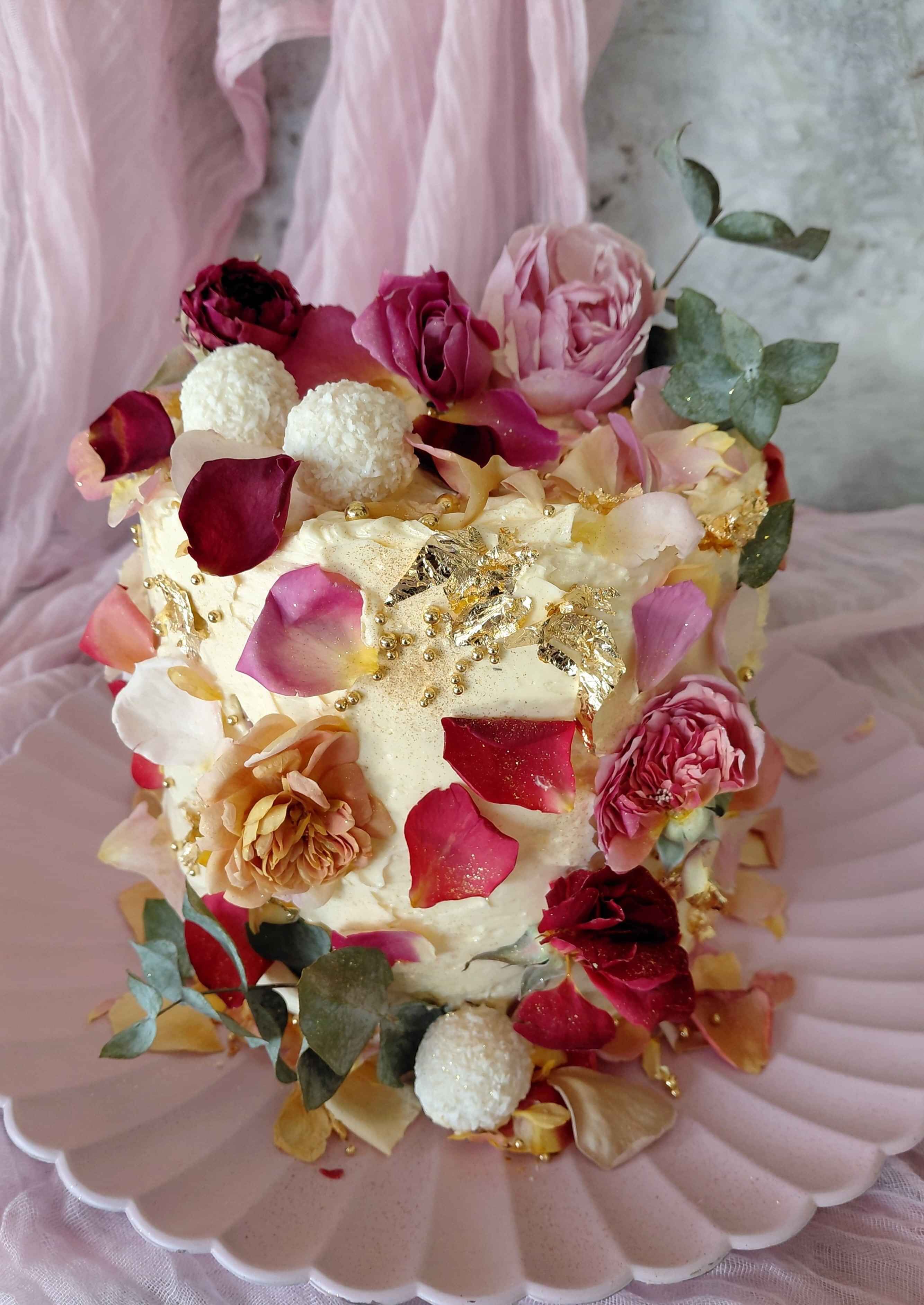 Luxury cakes with dried edible flowers and matching cupcakes with flowers