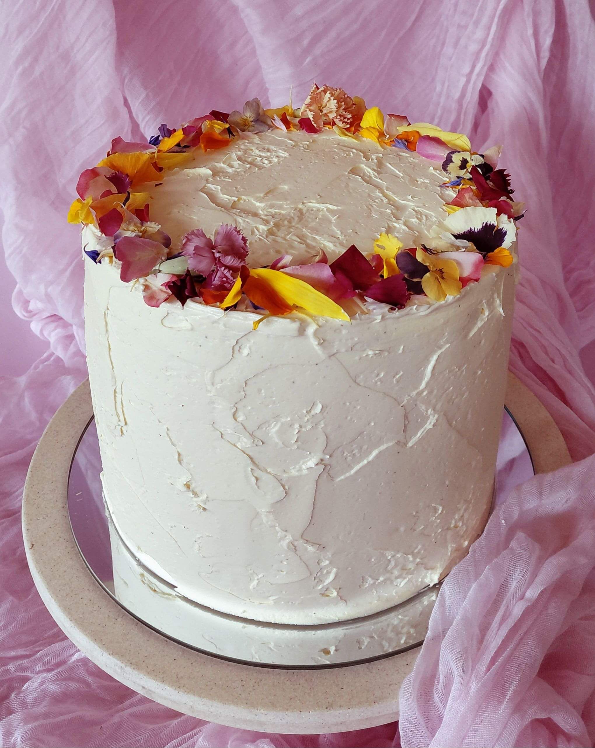Elegant vanilla luxury cake in Darwin with buttercream, pink roses and butterflies