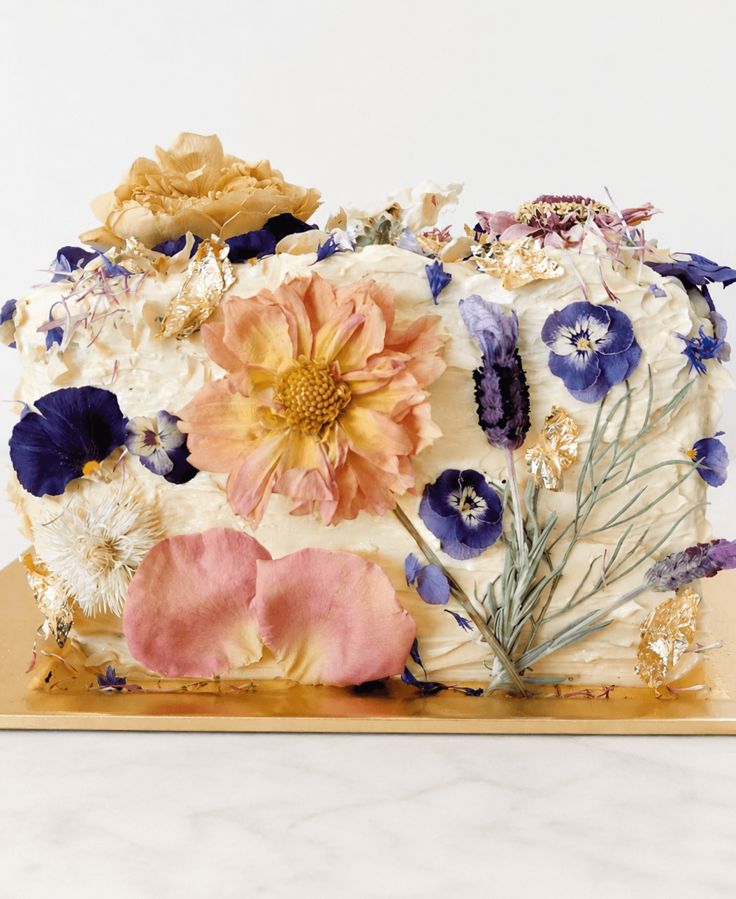 Elegant vanilla luxury cake in Darwin with buttercream, pink roses and butterflies