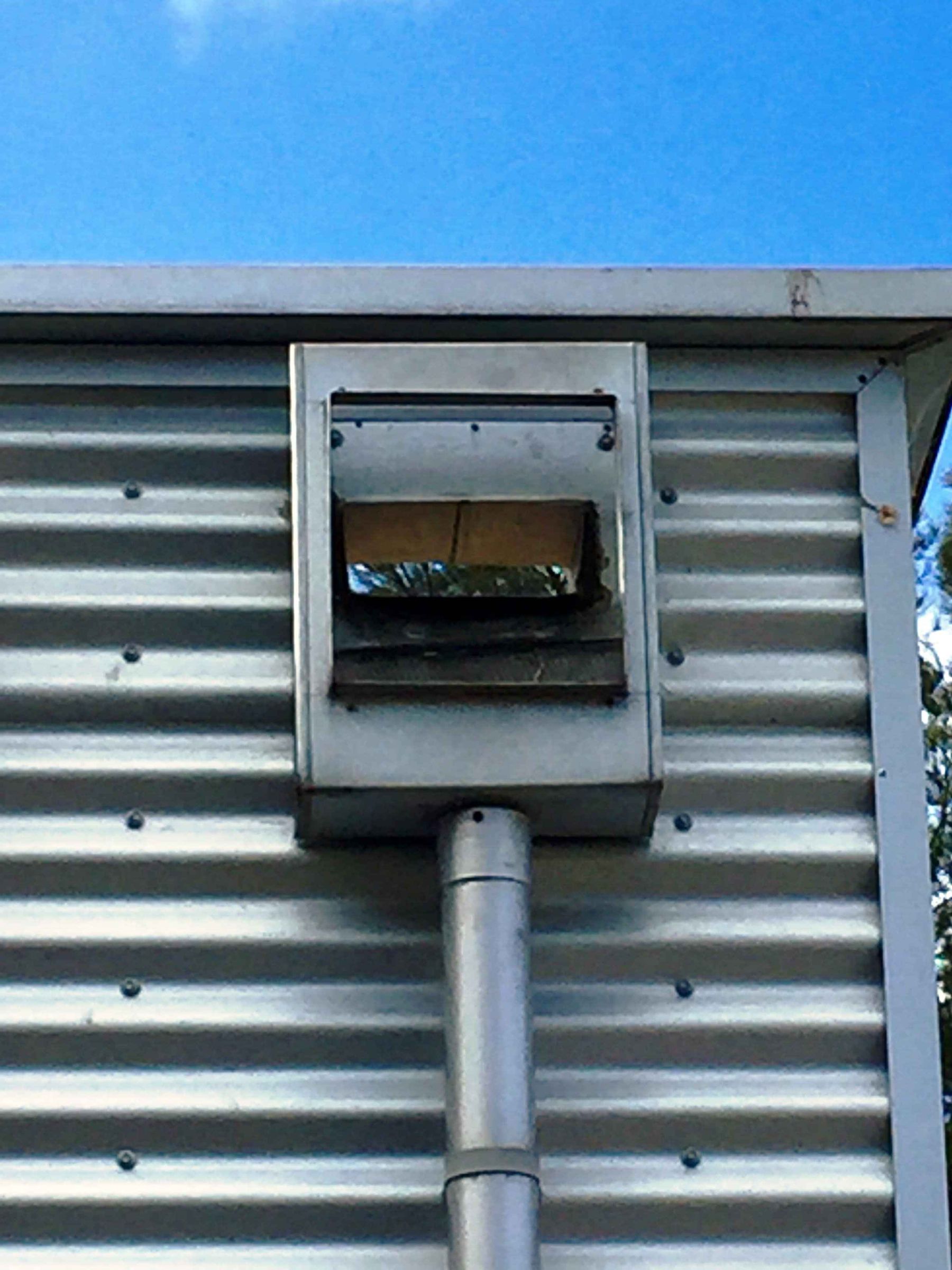 Example of a common non-compliant rain head