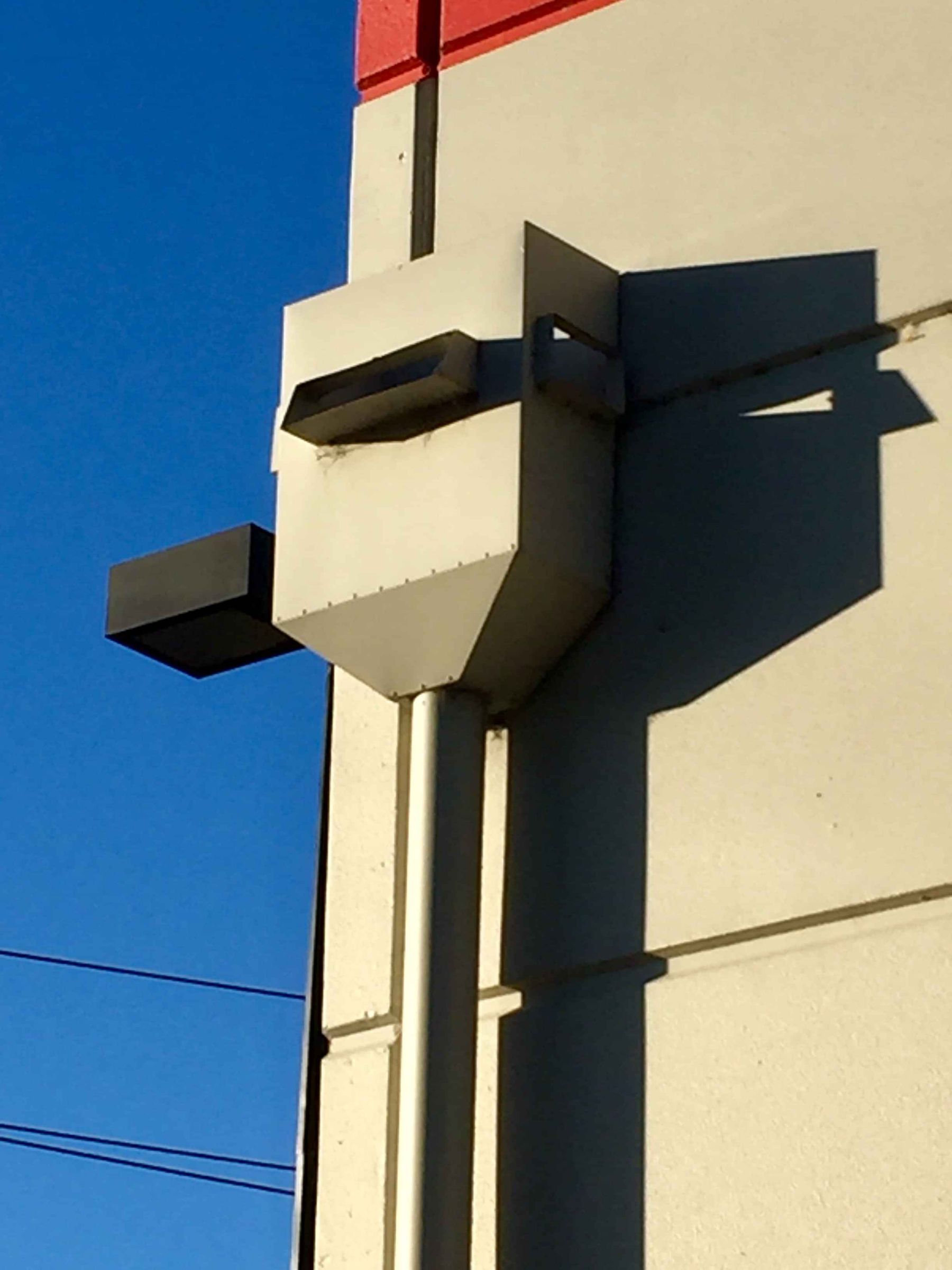Example of a common non-compliant rain head