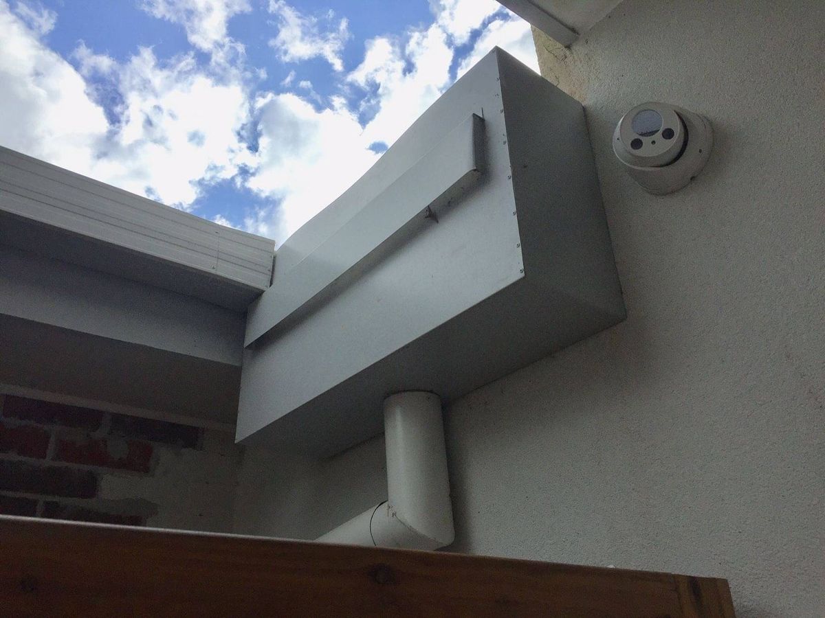 Rain head with the overflow slot covered over