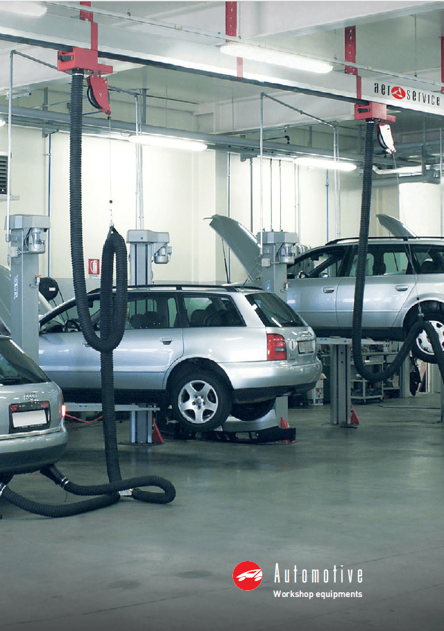 A auto vehicle workshop with hose reels on rails for exhaust fume extraction