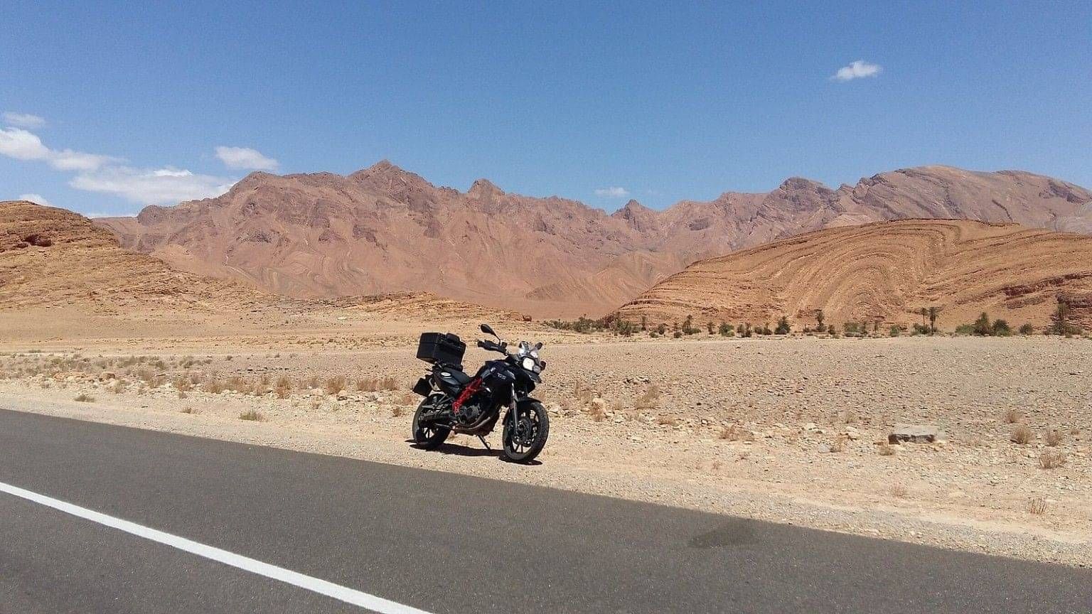 BMW motorcycle beside a road in Morocco’s Anti-Atlas Mountains