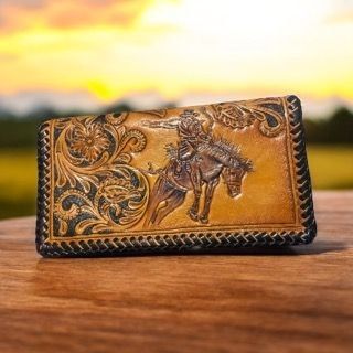 Leather carved saddle bronc purse