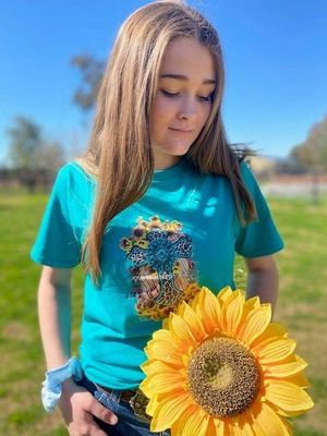 Turquoise cross shirt with sunflower 🌻