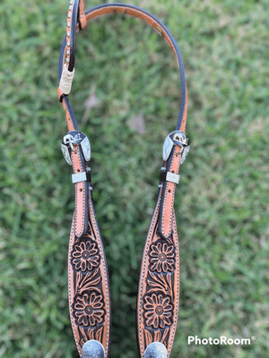 Tan one eared bridle with horse cowboy and cross