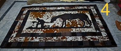 cowhide rugs-  man and horse