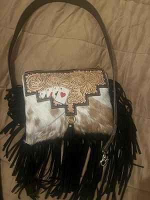 Handbag with tooled cards and cowhide