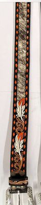 Tooled feather with cowhide inlay