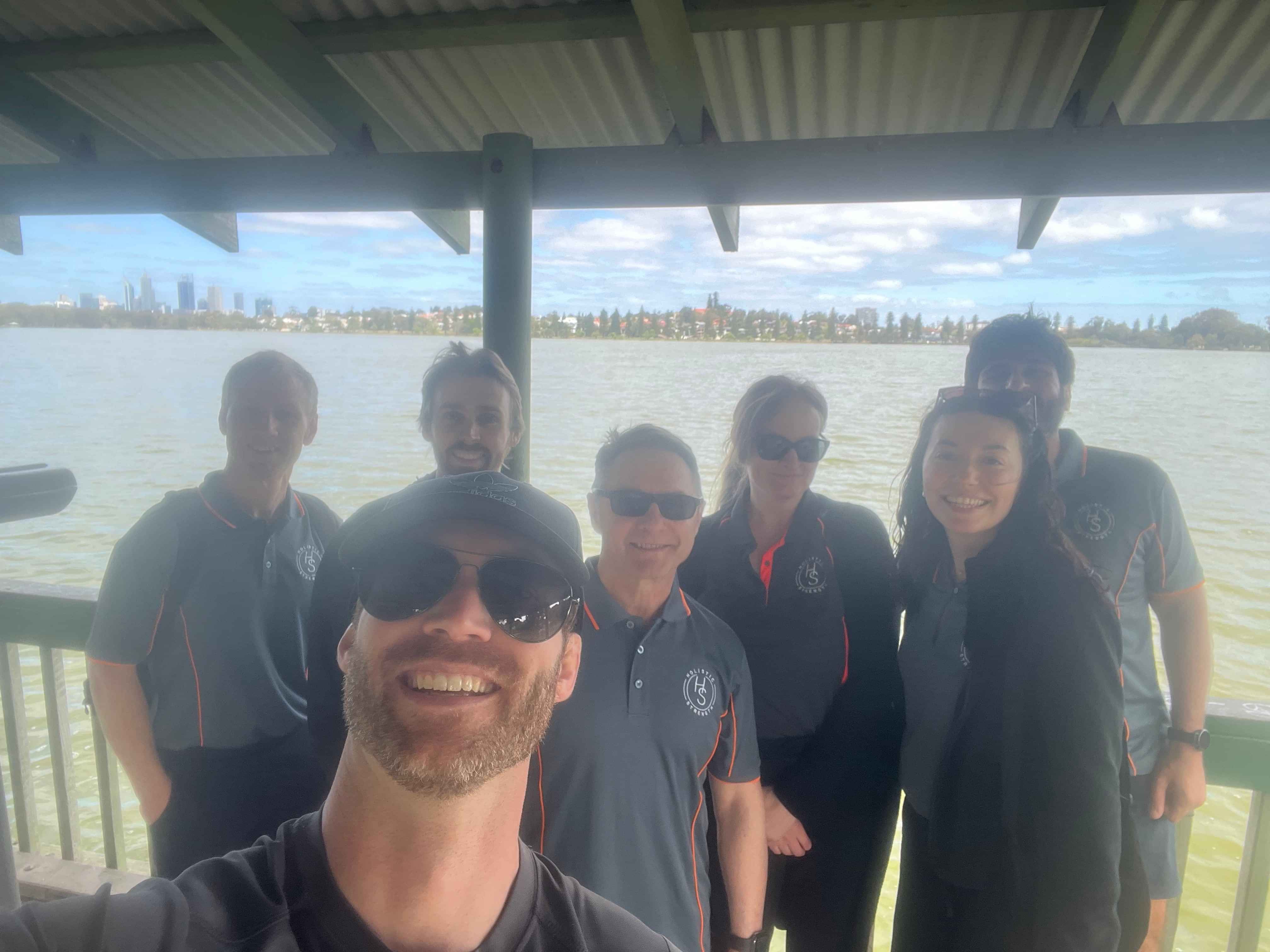 Team picture of Holistic Strength in the lake 