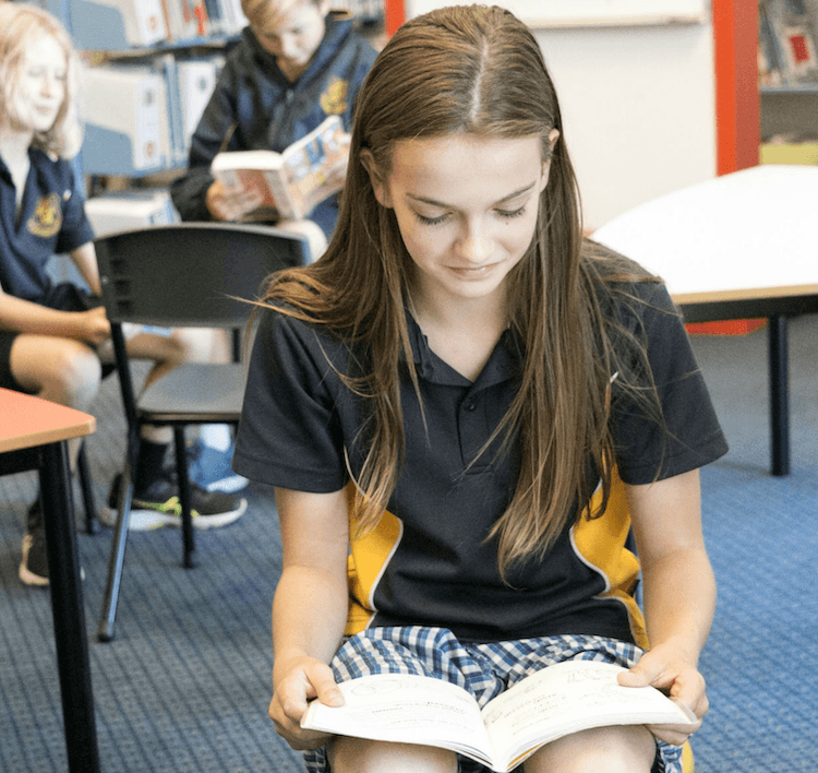 A student reading at Red Hill Consolidated School, Mornington Peninsula, Victoria