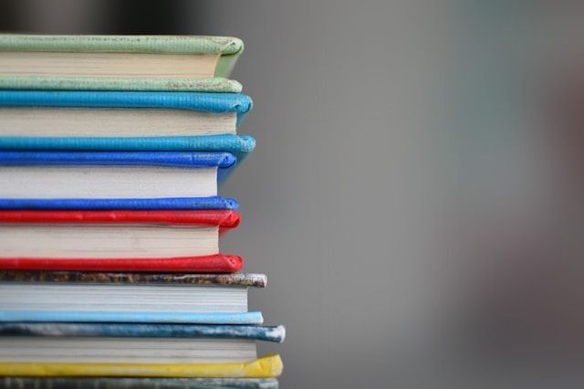 A stack of colourful books.