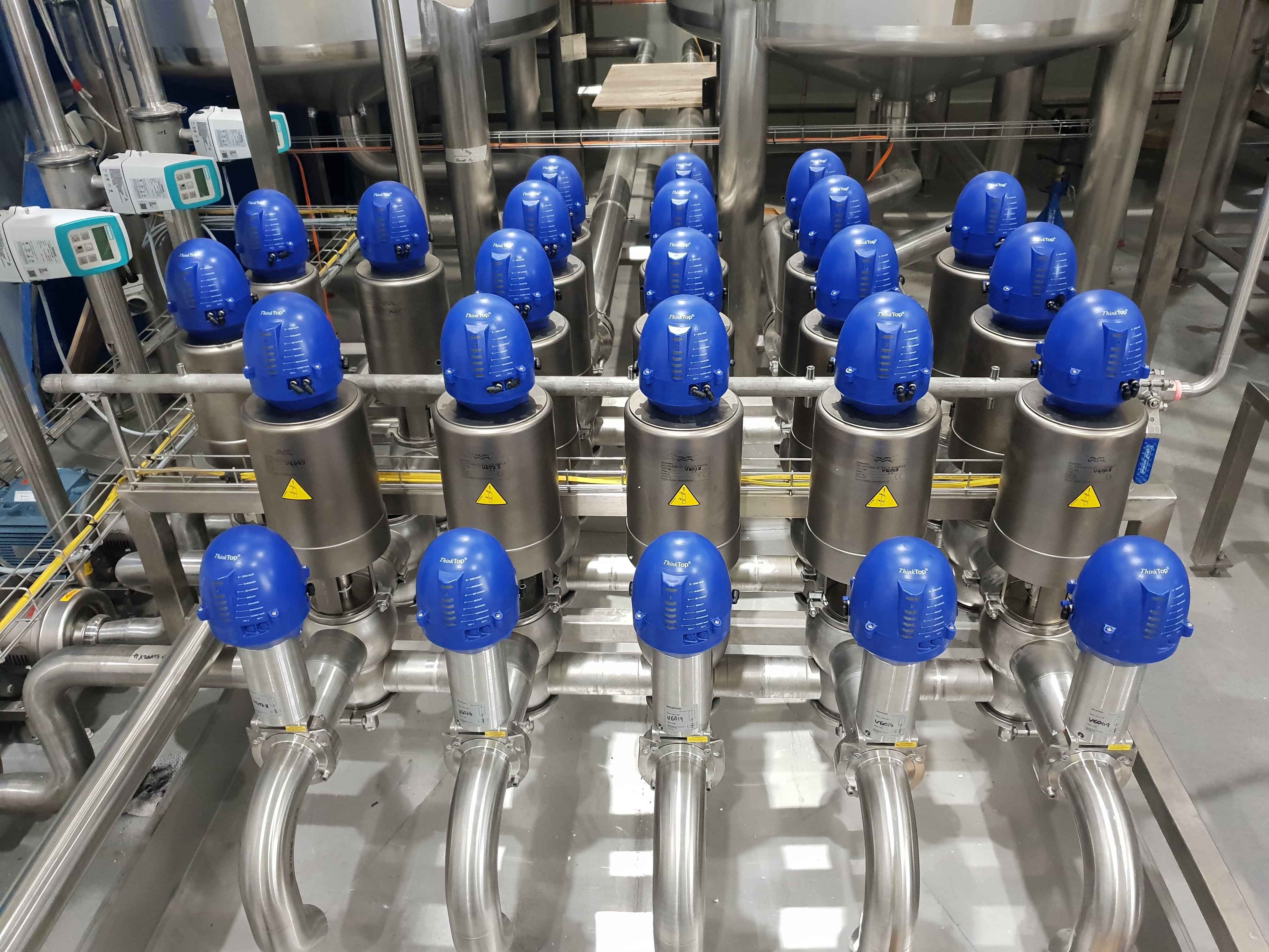 Automated hygienic process valve manifold and stainless steel piping for pharmaceutical GMP processing.
